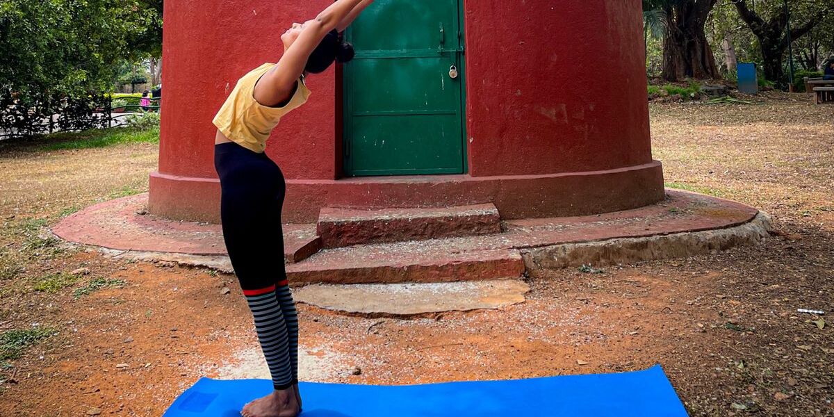 Medha in a private yoga pose outdoors
